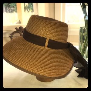 Straw dressy hat. Very cute for any outing.